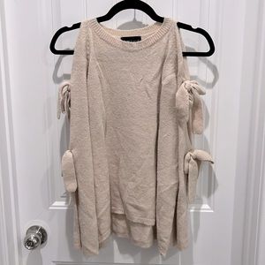 Sweater with open shoulders and tie details